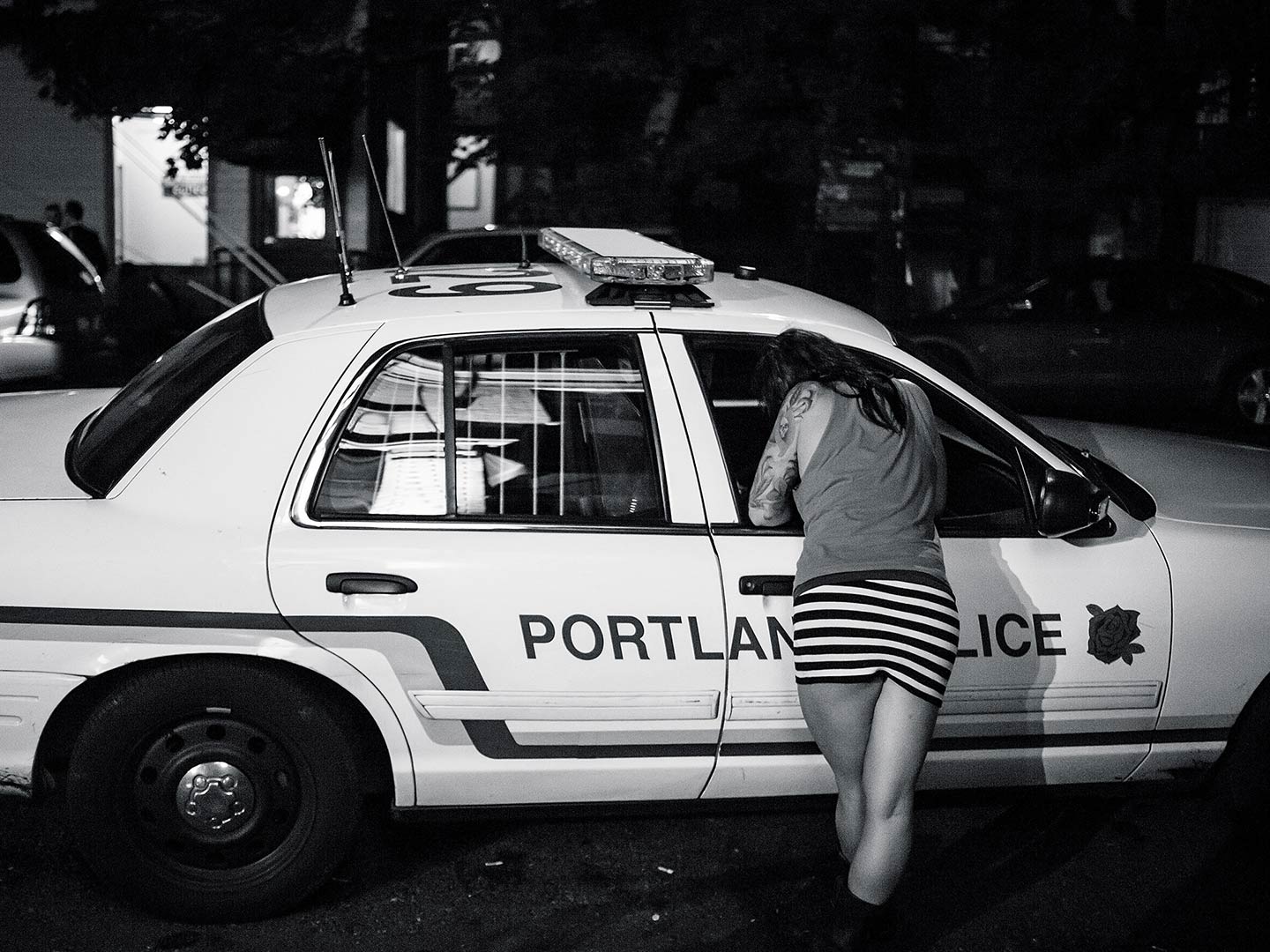 Police Car Talks to Partygoer